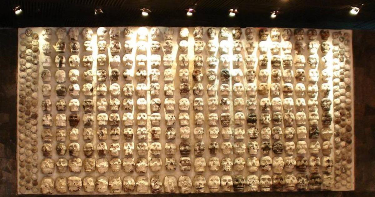 Display of wooden rack filled with skulls, used by Mesoamerican societies (including the Maya) to display the heads of sacrificial victims, at the Templo Mayor Museum in Mexico City. 