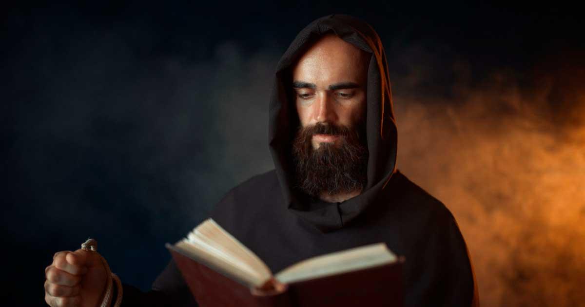 Medieval monk praying with a Bible and a rosary.	Source: Nomad_Soul / Adobe Stock