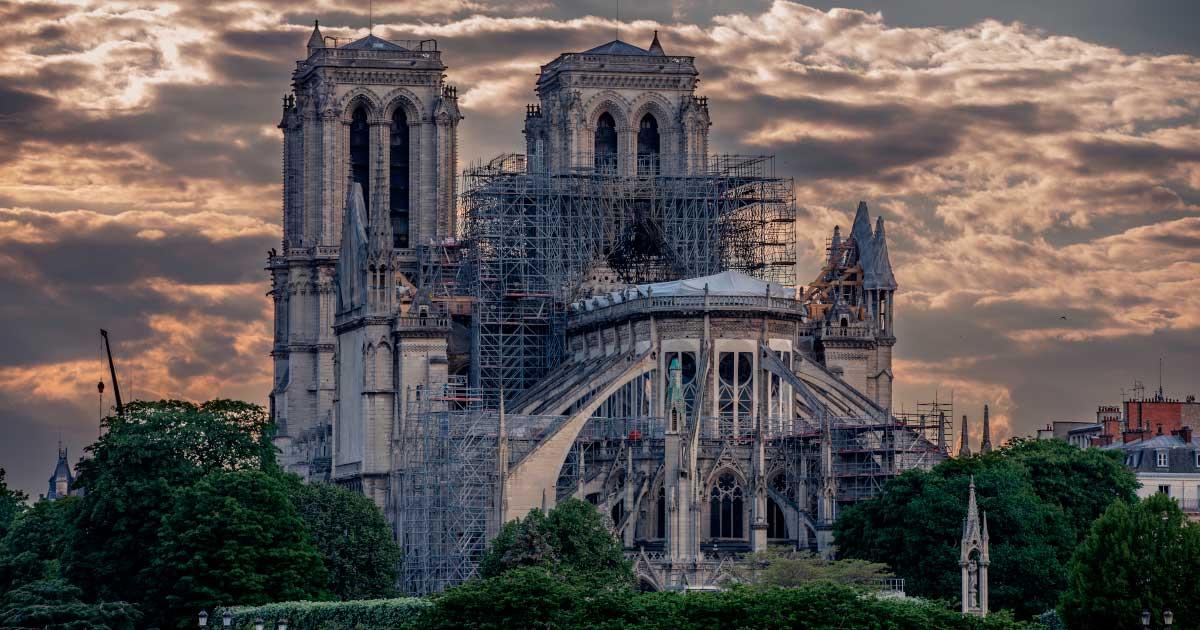 Notre Dame restoration work in progress. Much of this restoration revolves around giant pieces of wood to rebuild key structural areas and scaffolding destroyed by the disastrous 2019 fire at the cathedral. Source: JEROME LABOUYRIE / Adobe Stock