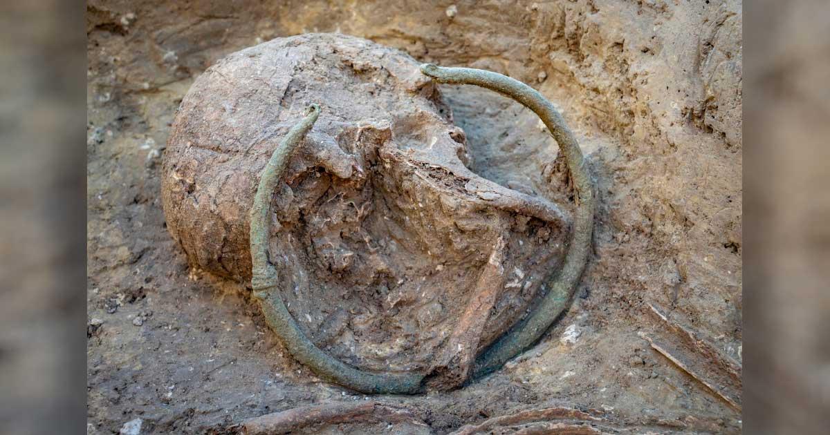 A copper torc was excavated from a prehistoric necropolis in southern France. Source: Denis Dubesset / INRAP