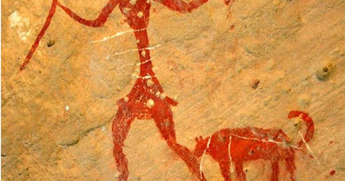 A rock painting possibly depicting a person with a dog. 