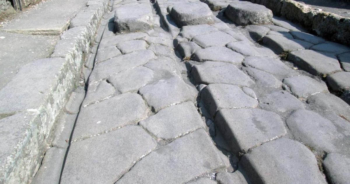 The passage of carts over decades could cause ruts (like the one shown), particularly in high-traffic areas of Pompeii.