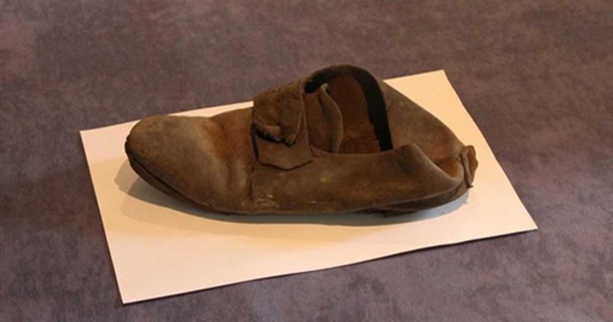 This 300-year-old shoe was discovered behind a wall at St John's College and is thought to have been an amulet meant to ward off evil. (St. John’s College photo)