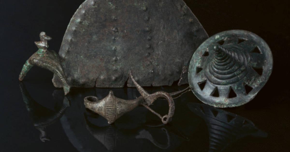 Early Iron Age metal finds from Somló Hill, including a sculpted disc, a brooch, and a large pendant.