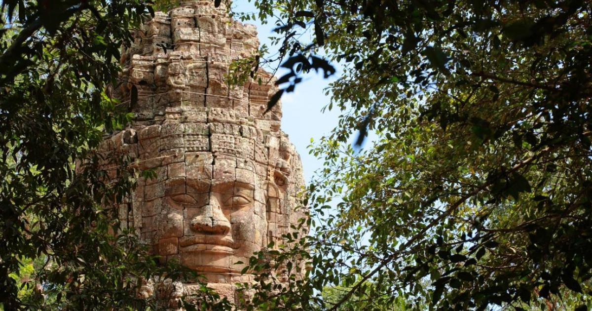 Monumental stone face at Bayon Temple, Cambodia. 