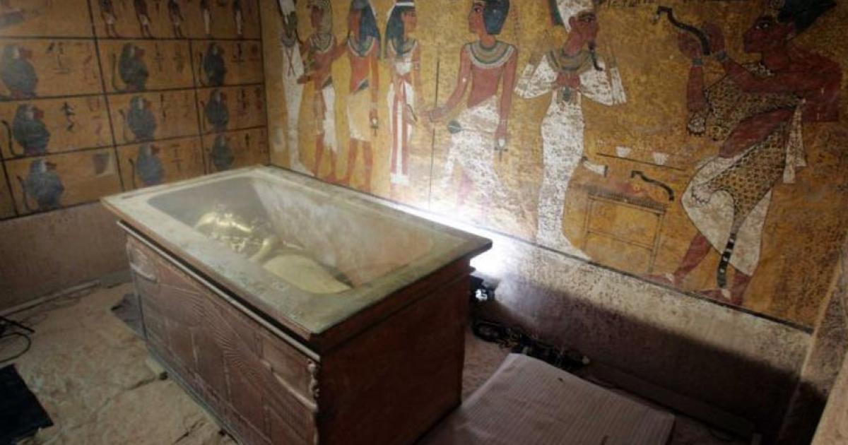 The stone sarcophagus containing the mummy of King Tut is seen in his underground tomb.