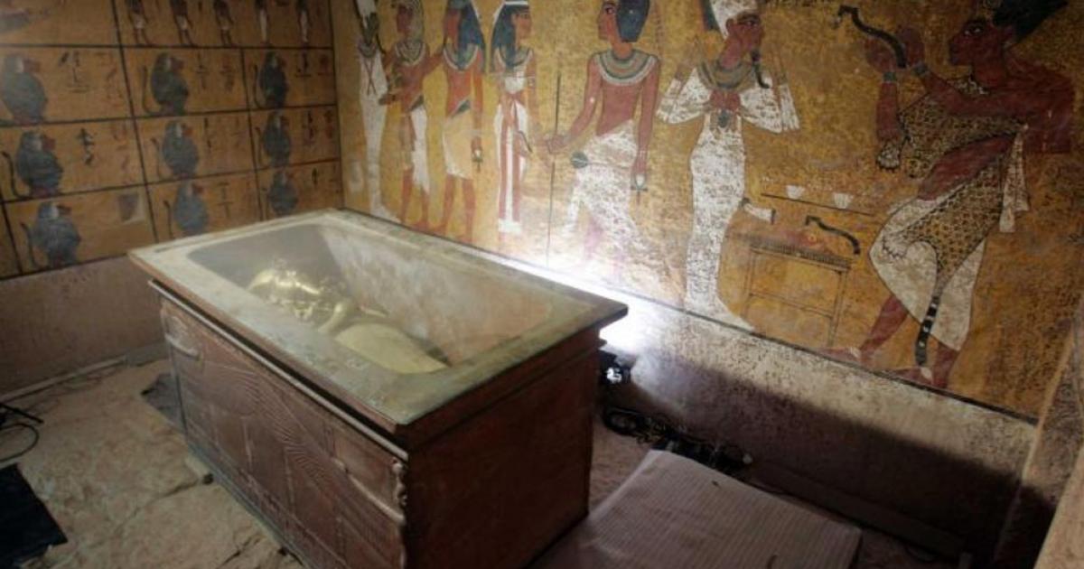 The stone sarcophagus containing the mummy of King Tut is seen in his underground tomb. 