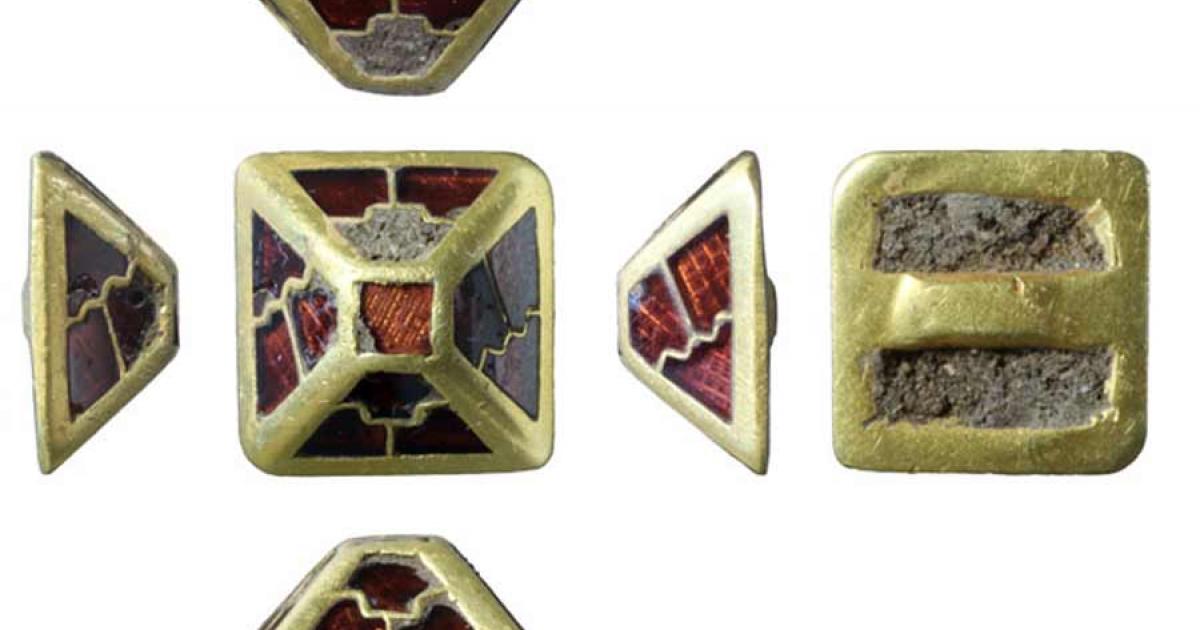 The gold and garnet sword harness pyramid found in Norfolk, England.