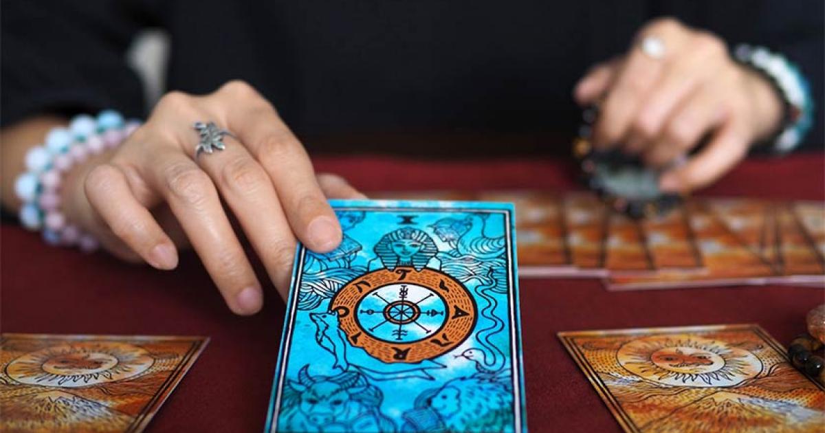 Tarot card reading. Credit: Benjavisa Ruangvaree / Adobe Stock