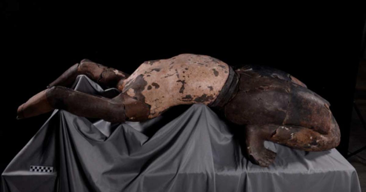 The terracotta figure represents an acrobat, created to provide entertainment in the afterlife for Emperor Qin Shi Huang. Source: Xinhua