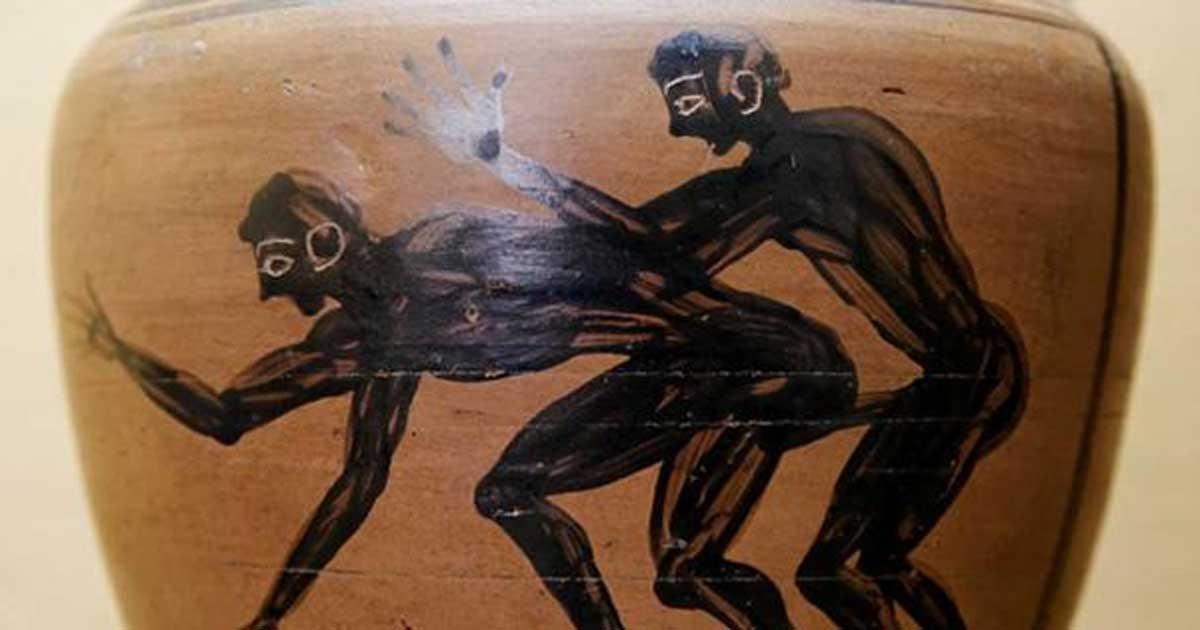 Two youths engaged in sex, one of them holding a hoop. Detail from an amphora