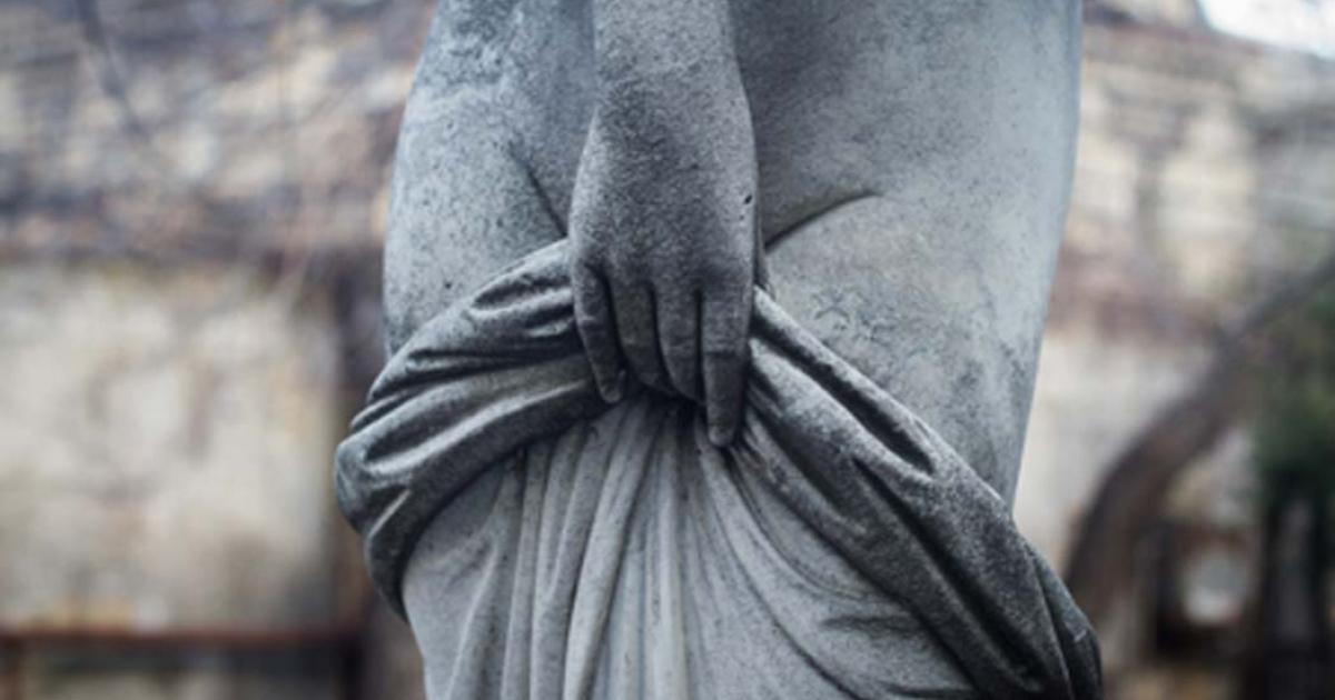 Statue of a woman covering herself. Credit: macondos / Adobe Stock