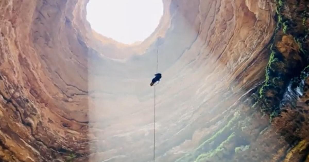 An Omani Caves Exploration Team member about to descend to the bottom of Yemen’s legendary Well of Hell.			Source: Screenshot / OCET Oman