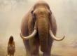 A female prehistoric hunter stands before a mammoth. Source: nsit0108 / Adobe Stock.