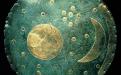 The Nebra sky disk is a bronze disk of around 30 cm diameter and a weight of 2.2 kg, with a blue-green patina and inlaid with gold symbols. (Source: Wikipedia)