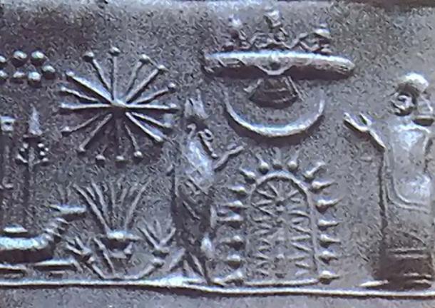 1st Millennium seal showing a worshipper and a fish-garbed sage before a stylized tree with a crescent moon & winged disk set above it. Behind this group is another plant-form with a radiant star and the Star-Cluster (Pleiades cluster) above. 