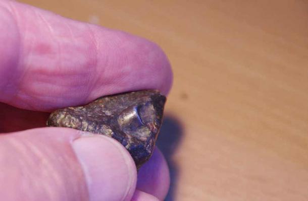 Anomalous Metallic Object Discovered Inside a 4.5 Billion-Year-Old Meteorite