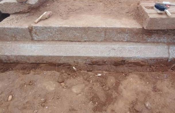 The 800-year-old inscription stone describing a Jain donation uncovered at Arattipura, India.