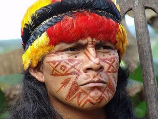 A Shuar man in traditional garb.