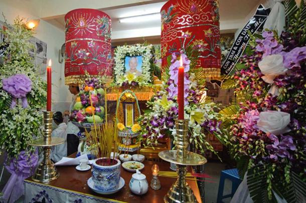 A Vietnamese funeral arrangement. (going slowly)