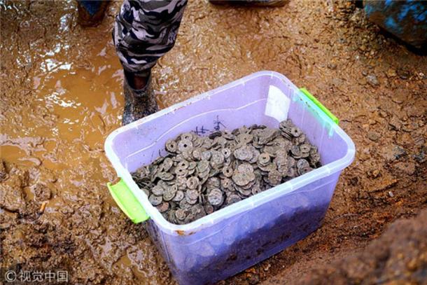 A container showing some of the coins found during construction work on a house in Jiangxi province.