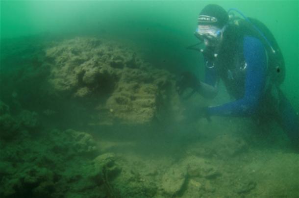 A diver examines the site (NOC)