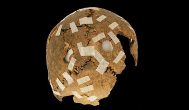 A fragmentary trophy skull with drilled hole modifications. (F. Garrido & C. Morales / Fair Use)