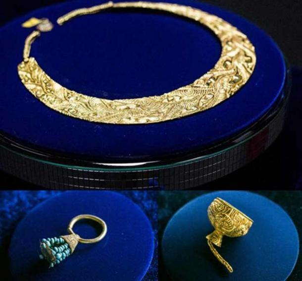 A gold pectoral in Animal Style decoration, golden earring with turquoise and a miniature gold cup discovered in the Arzhan 2 kurgan.