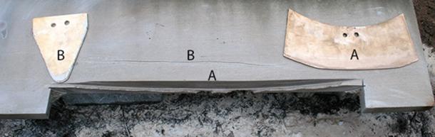 A limestone block displays a curved, Mycenaean-style cut made by a curved blade, A, and a shallow, wobbly incision made by a triangular blade, B. (N. Blackwell/Antiquity 2018)