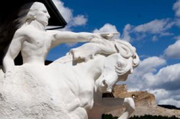 A model of the planned colossal sculpture, with the Crazy Horse Memorial in the background. (Ken Lane / CC BY-SA 2.0)