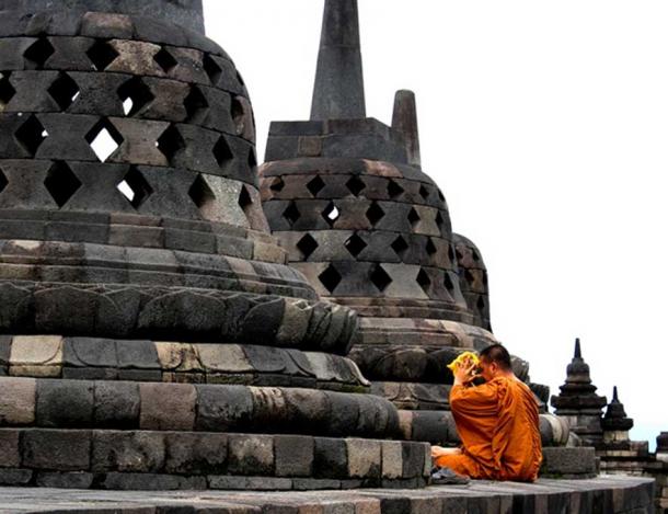 A monk prays at Borobudur.