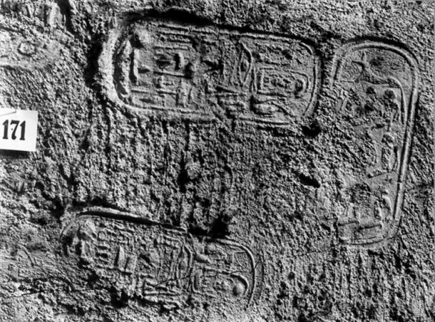 A portion of the first doorway of KV62, showing the seal of the Royal Necropolis - the jackal over nine captives - and Tutankhamun's name. (Public Domain: Harry Burton. Griffith Institute, Oxford)