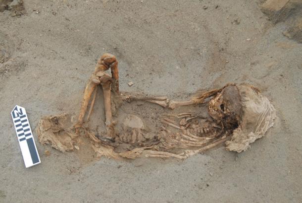 A typical child burial laying on its back with the legs flexed and cloth over the head. (© 2019 Gabriel Prieto et al / Plos ONE)