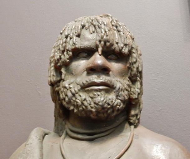 Sculpture of an Aboriginal Australian man.
