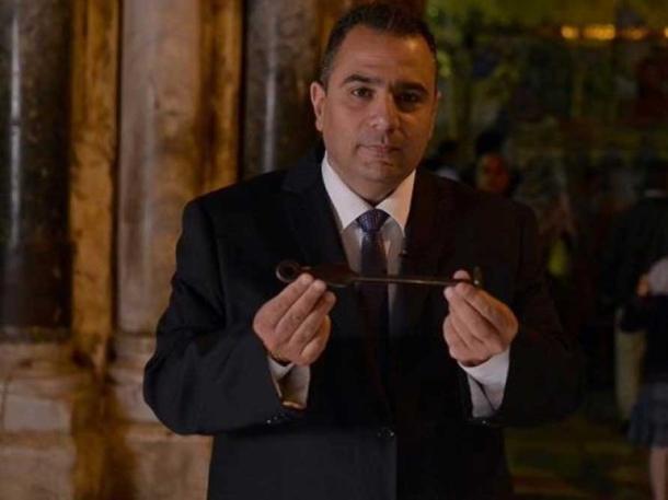 Adeeb Joudeh, the current custodian, with the key.