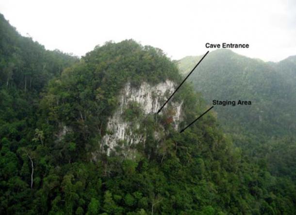 Aerial photograph of the karst cliff containing Kayuko Naj Tunich. Locals refer to the tower in Mopán as Suk Tunich or White Rock.