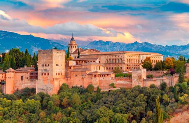 The Alhambra is a fortress and palace complex located in Granada, Andalusia, Spain. It was constructed in the mid-14th century during the Nasrid dynasty and is known for its stunning Islamic architecture, intricate carvings, and ornate tile work. The Alhambra is now a UNESCO World Heritage Site and one of the most popular tourist attractions in Spain, attracting millions of visitors every year. Source: pillerss / Adobe Stock