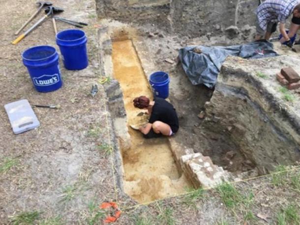 An ECU archaeology student probes the foundations of a probable tavern at Brunswick Town. (Ben Steelman/Starnews)