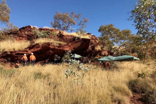 An archaeological dig is underway in this cave, located about 10km from BHP Billiton's Mining Area C iron ore mine in the West Australian Pilbara region. (ABC News)