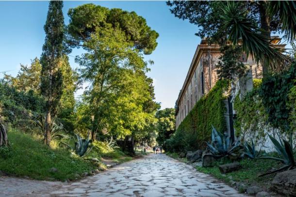An existing section of the Appian way runs through and out of Rome.(Martina/Adobe Stock)