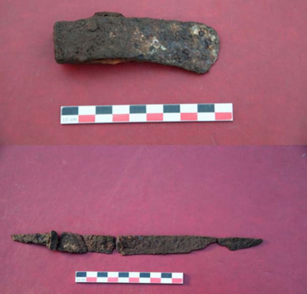 An iron hatchet and knife were found buried with the warrior woman. (Artur Kharinsky/The Siberian Times)