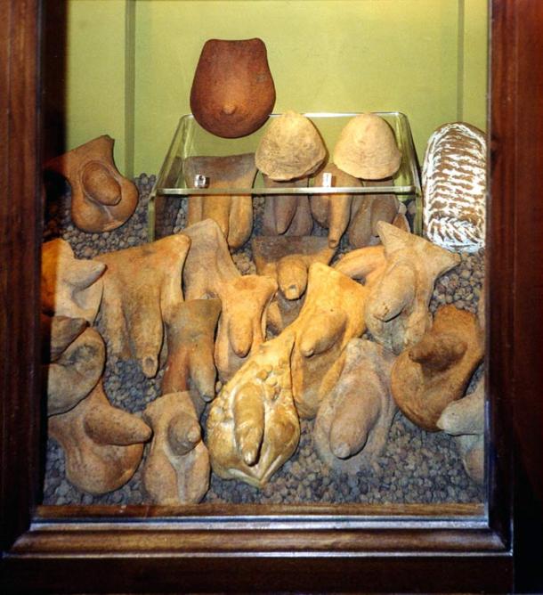 Ancient terracotta sculptures of private parts: penises, a breast and, on the right, a womb at the Museo Archeologico Nazionale of Naples.