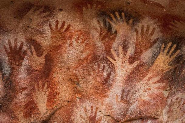 Ancient cave paintings of hands at Cueva de Las Manos in Santa Cruz Province, Patagonia, Argentina. (R.M. Nunes / Adobe Stock)
