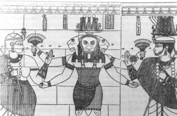 Apedemak depicted as a three-headed leonine god with four arms. 