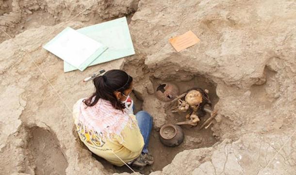 Archaeologist Mirella Ganoza examining one of the burials in Lima, Peru.
