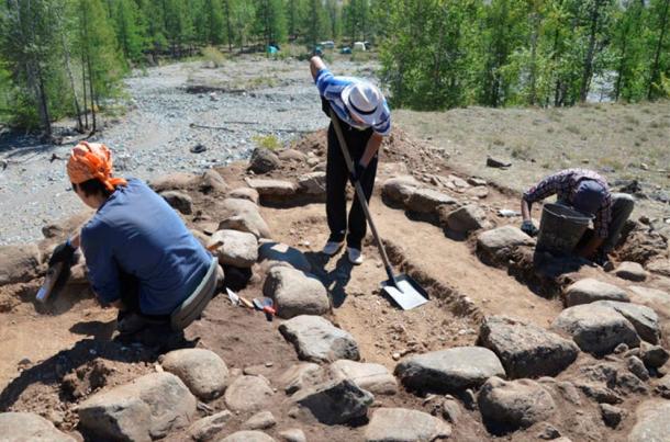 Archaeologists excavating the site where the infant’s remains were found.