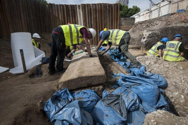 Archaeologists prepare to lift the lid at the site in Swan Street, Southwark