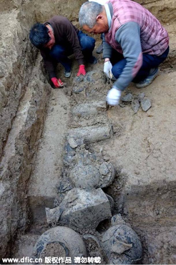 Archaeologists uncovering relics in one of the newly-discovered tombs. 