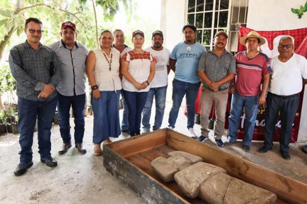 Archaeologists during press conference presenting the Huastec statue in Mexico. (INAH)