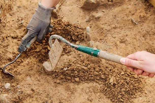 Archeologist working on site of the location were Pleistocene footprint was discovered. (NERYX / Adobe)